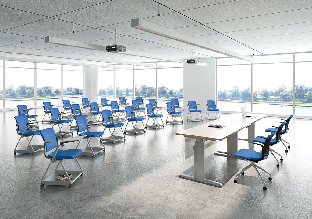 Myko chairs in blue fabrics in a training room with Vertigo 1.0 height adjustable table
