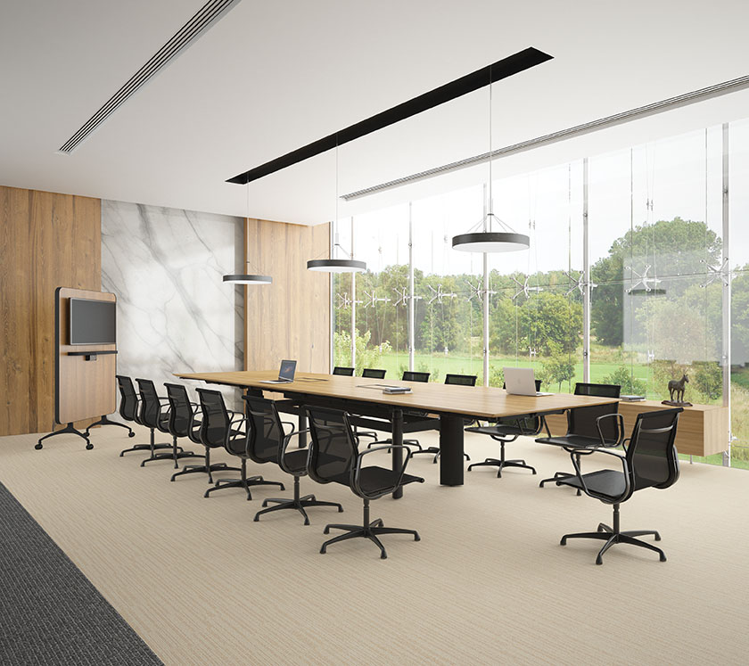 Black Como Air office chairs with Vertigo height adjustable conference table in a modern conference room with full height glass windows
