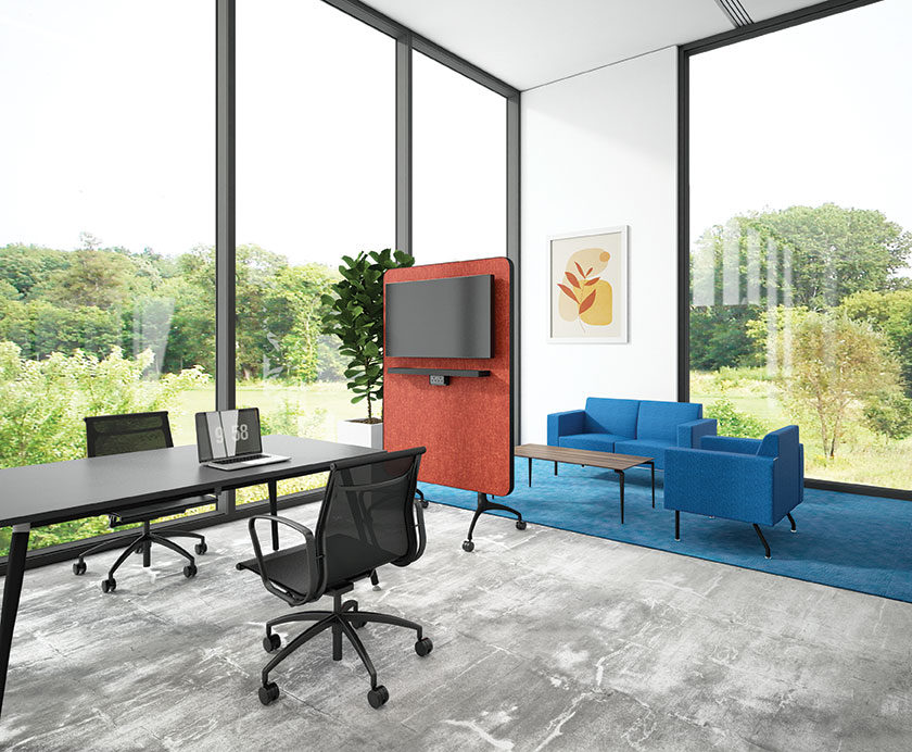 A red Zones Media mobile panel in the middle of the Artiv meeting table and Virtu SV sofa with Loft coffee table