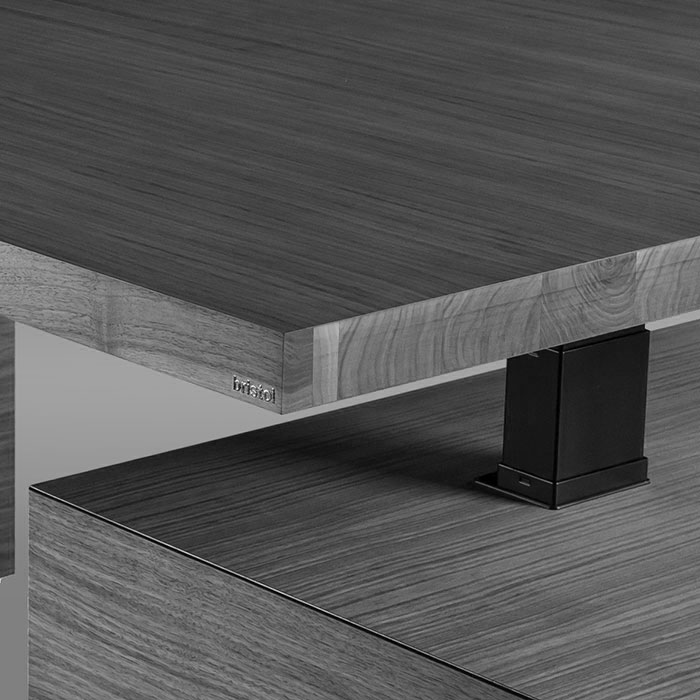 A B&W closeup of Kanye height adjustable table