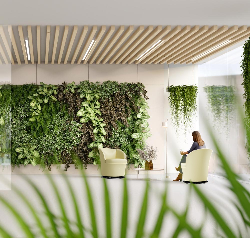 Swell lounge armchairs in a waiting area with planted wall