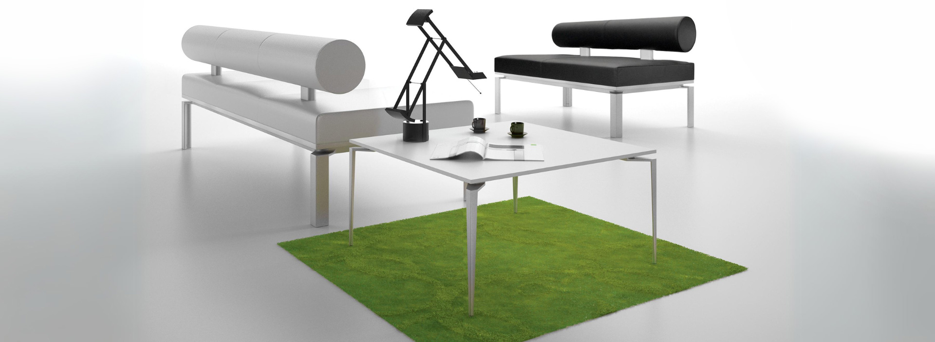 loft coffee table on a green carpet with loft sofa in black and white leather.