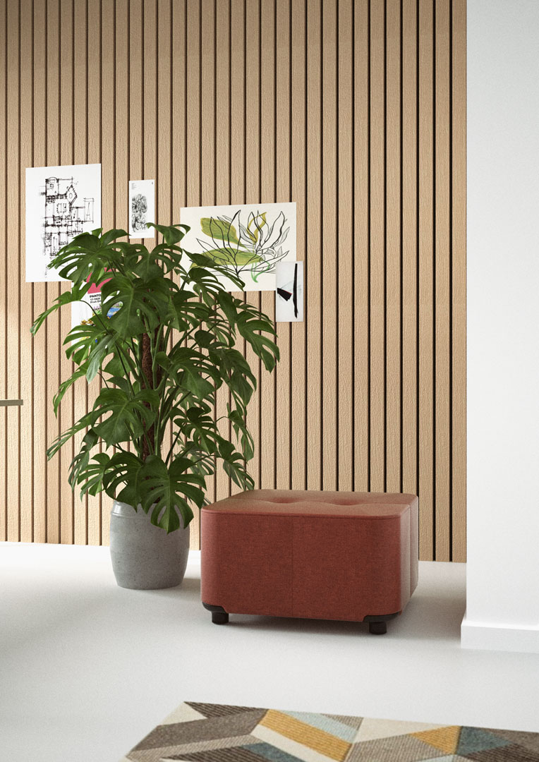 Modu single in red leather beside a monstera plant in a room with wooden wall decor.